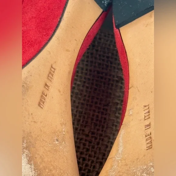 Salvatore Ferragamo red suede pumps featuring a gold-toned ornamental buckle